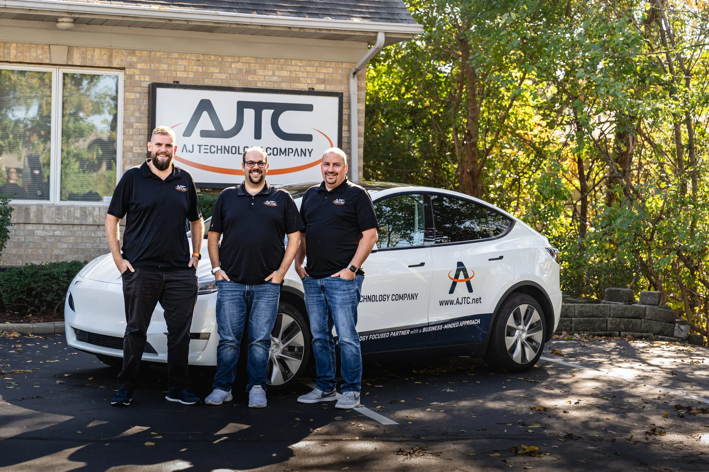 AJTC leadership team outside the Homer Glen headquarters