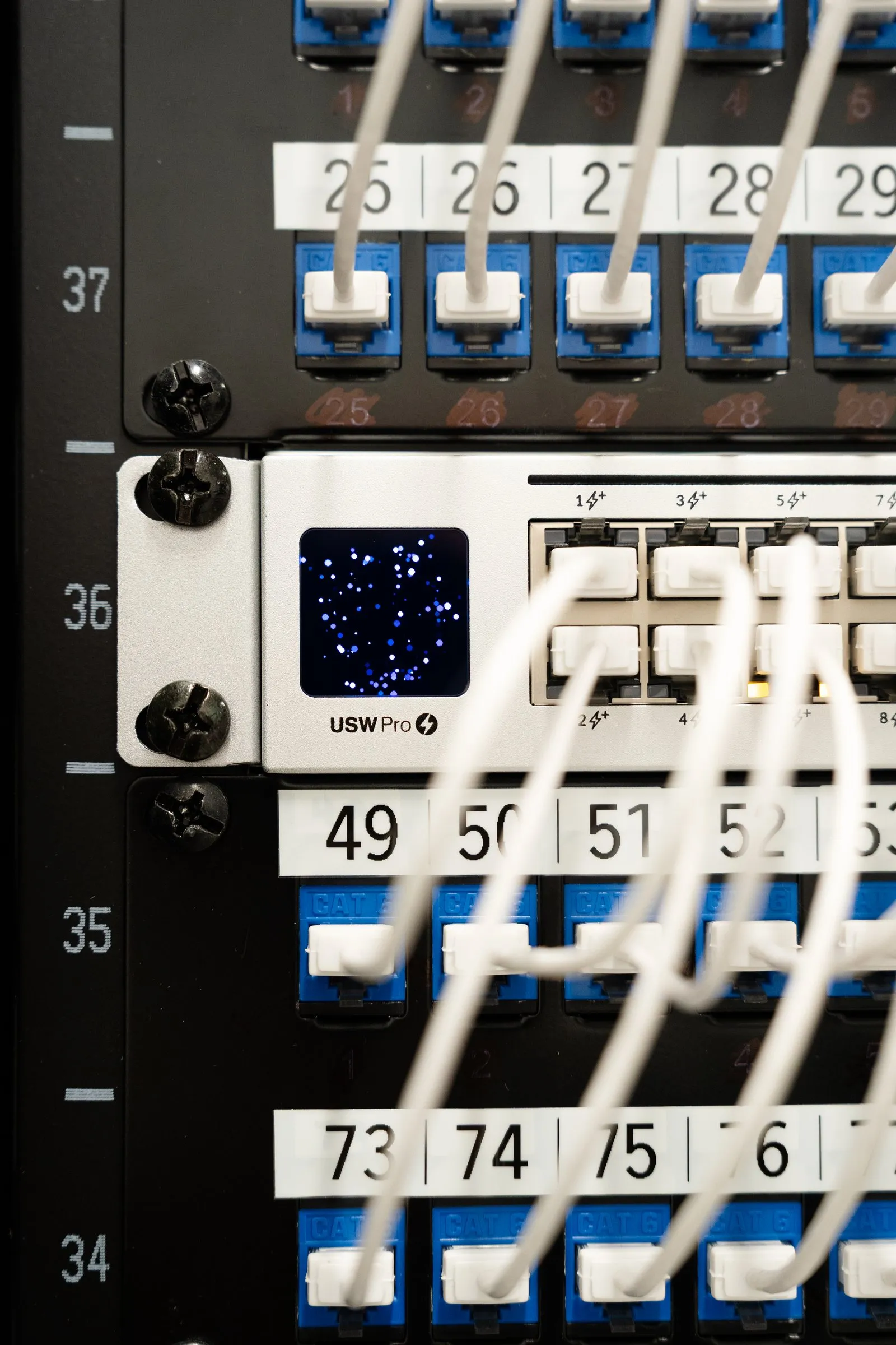 Numbered patch panel with color-coded cabling