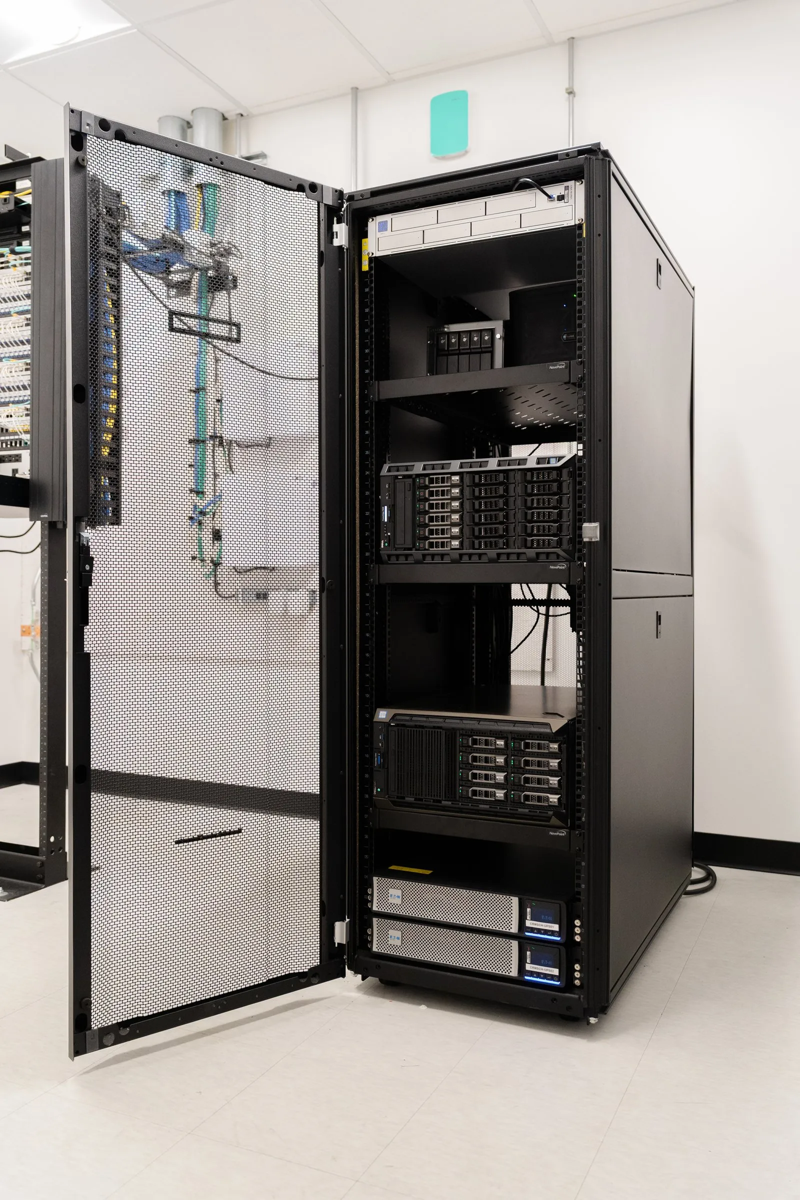 Open server cabinet in a dedicated server room