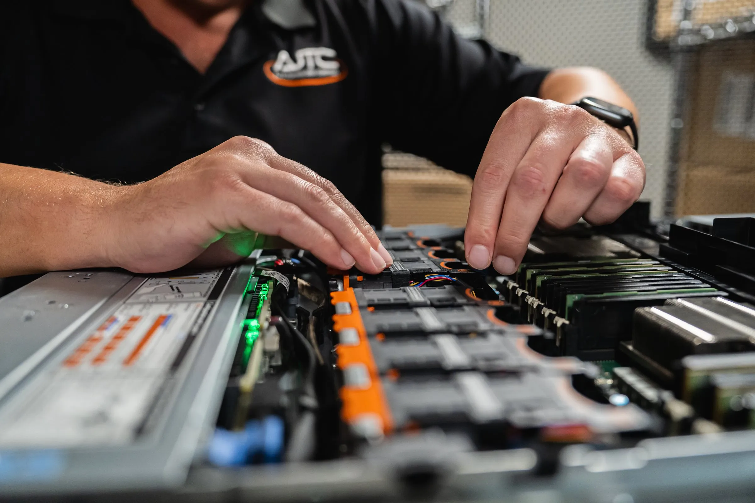 AJTC engineer working inside a business server