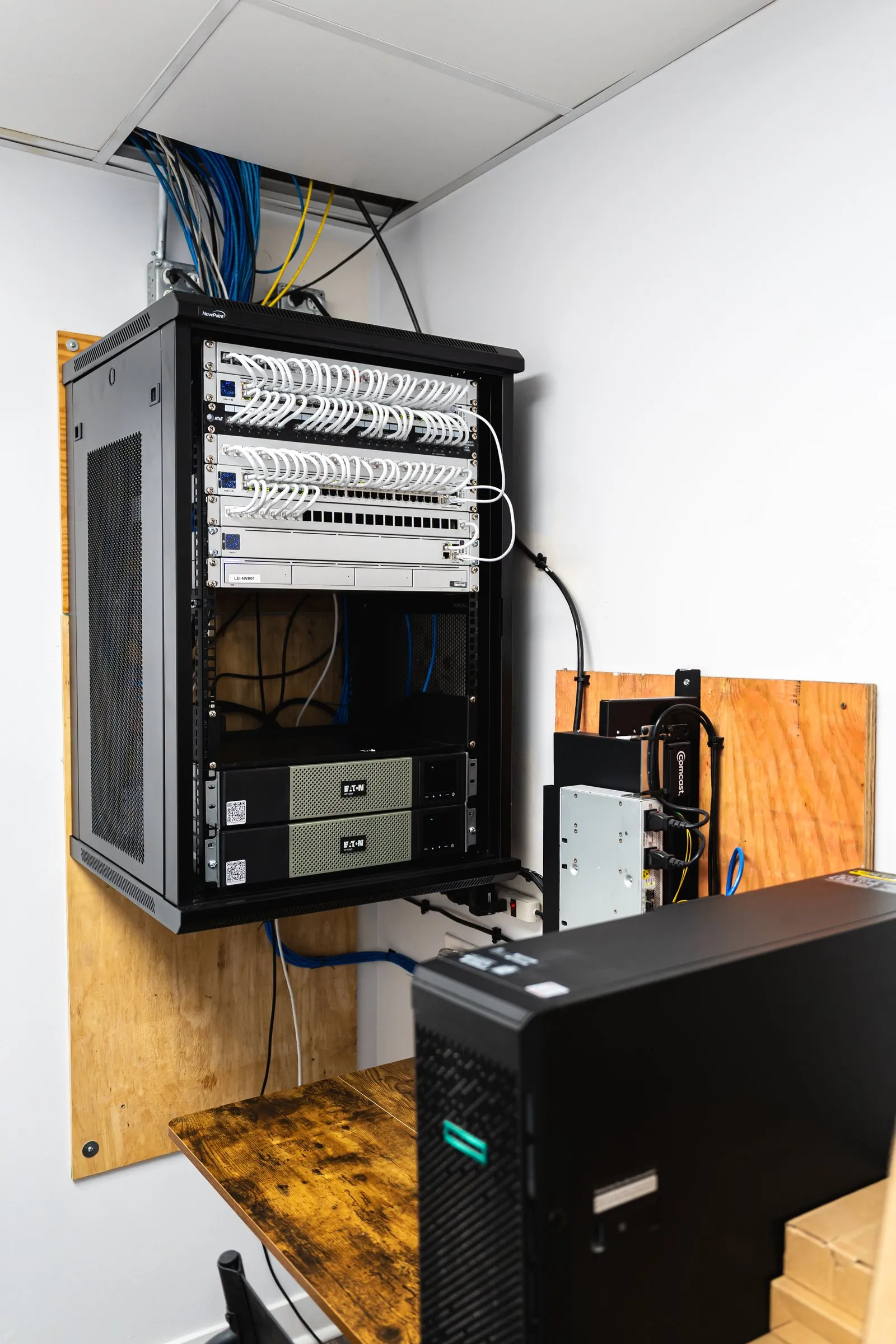 Wall-mounted network rack and server for a small business
