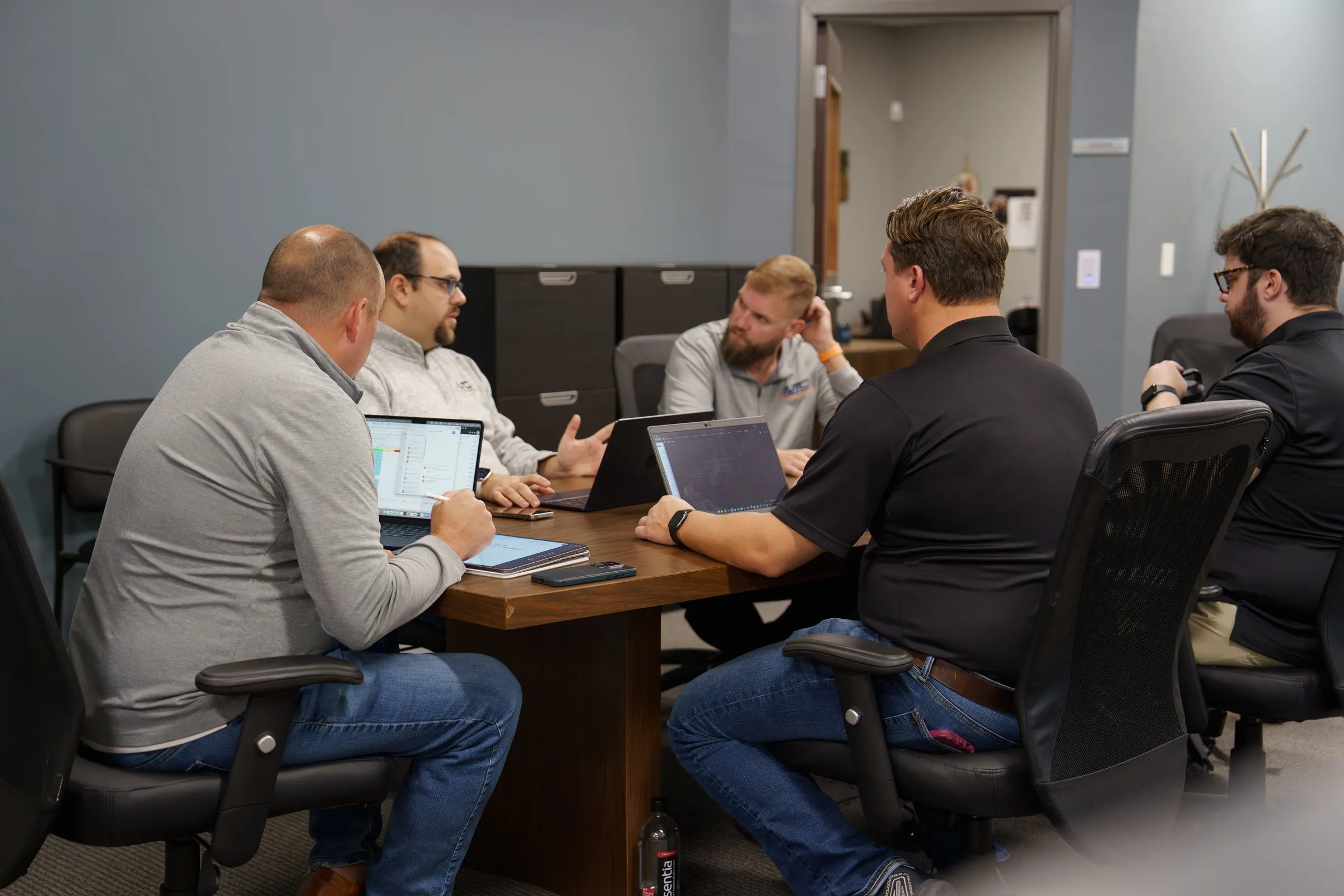 AJTC team in a weekly client review meeting