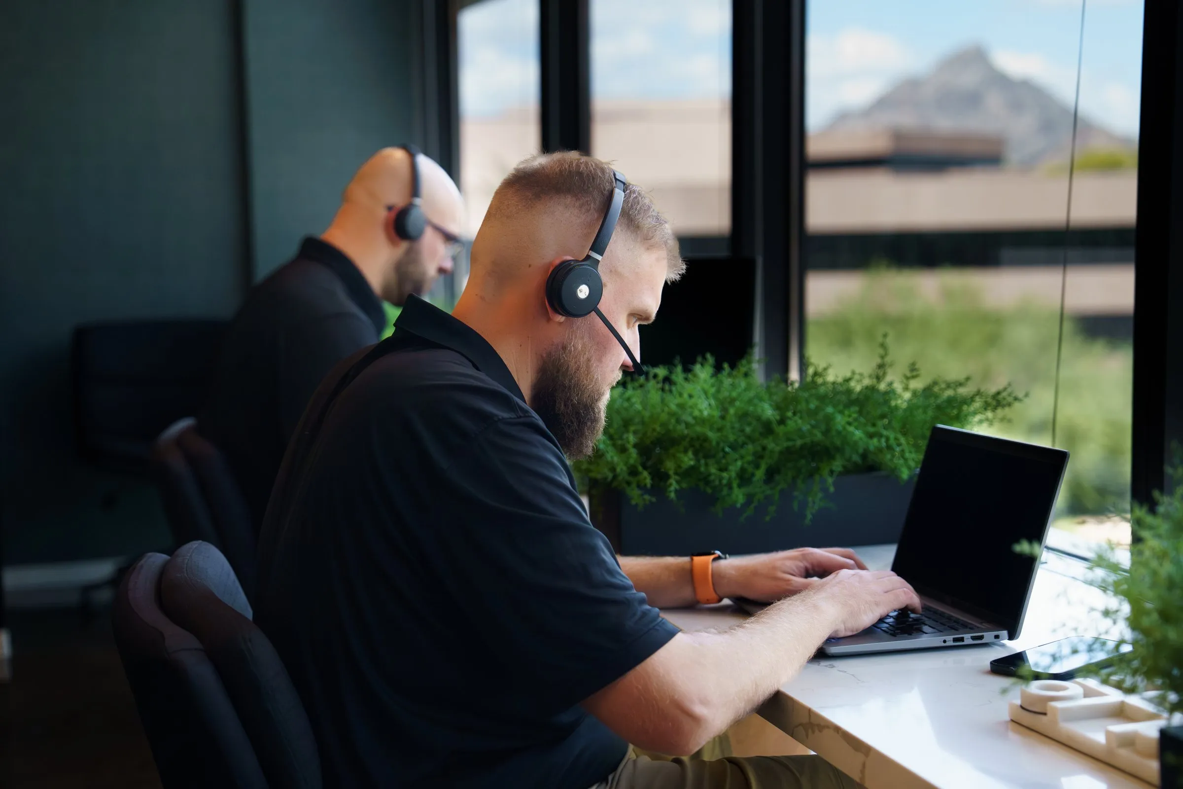 AJTC Phoenix technicians on support calls with Camelback Mountain in view