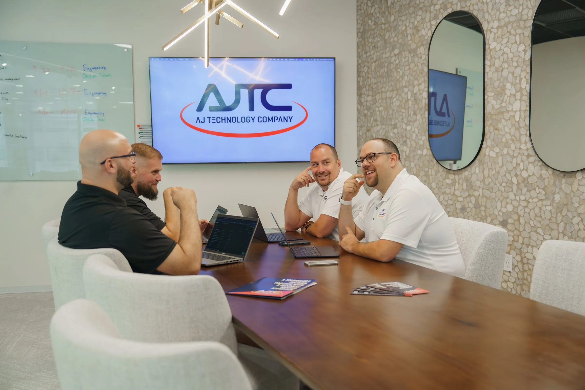 AJTC Phoenix team meeting in the conference room